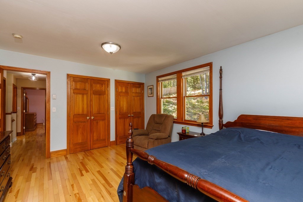 283 Mill Street Gardner, MA 01440 - Photo 12 of 30 a bed room with a bed and a chair