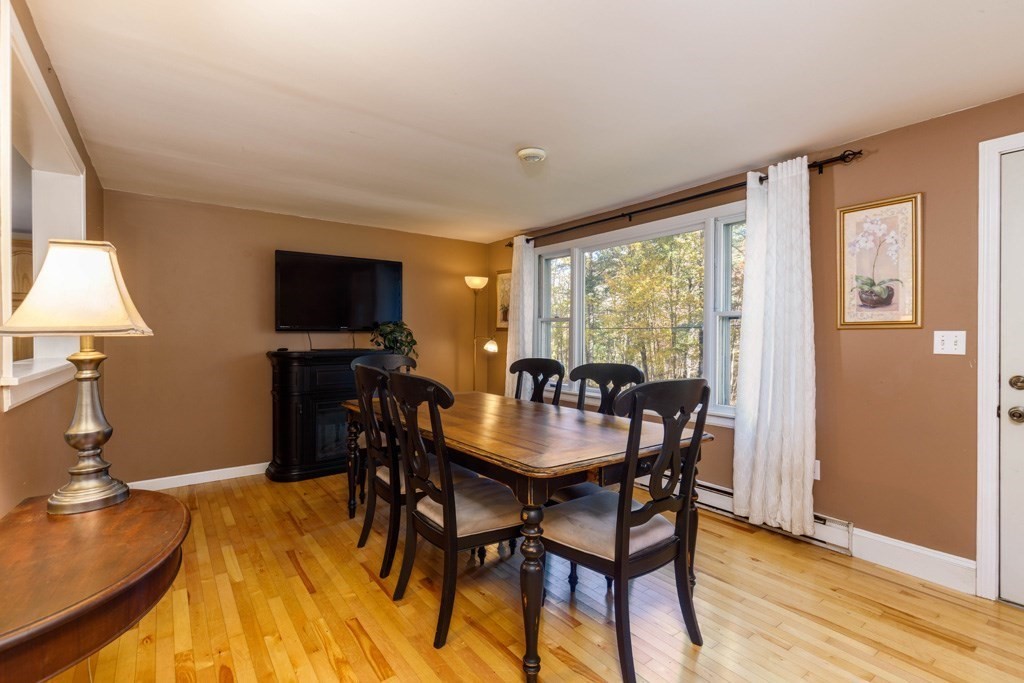 283 Mill Street Gardner, MA 01440 - Photo 5 of 30 a view of a dining room with furniture window and wooden floor