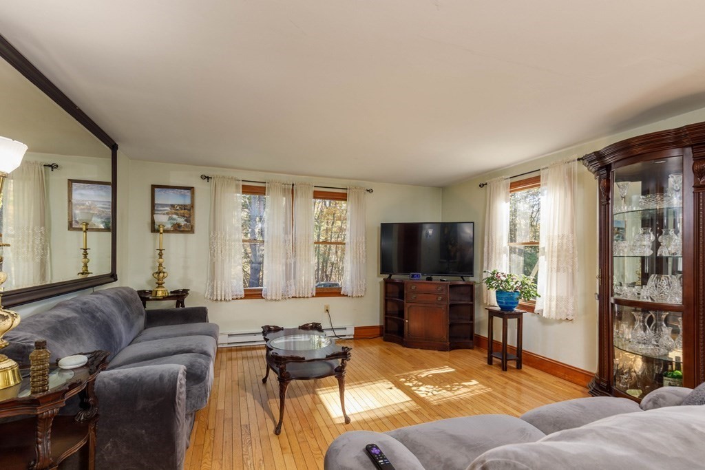 283 Mill Street Gardner, MA 01440 - Photo 8 of 30 a living room with furniture and a flat screen tv