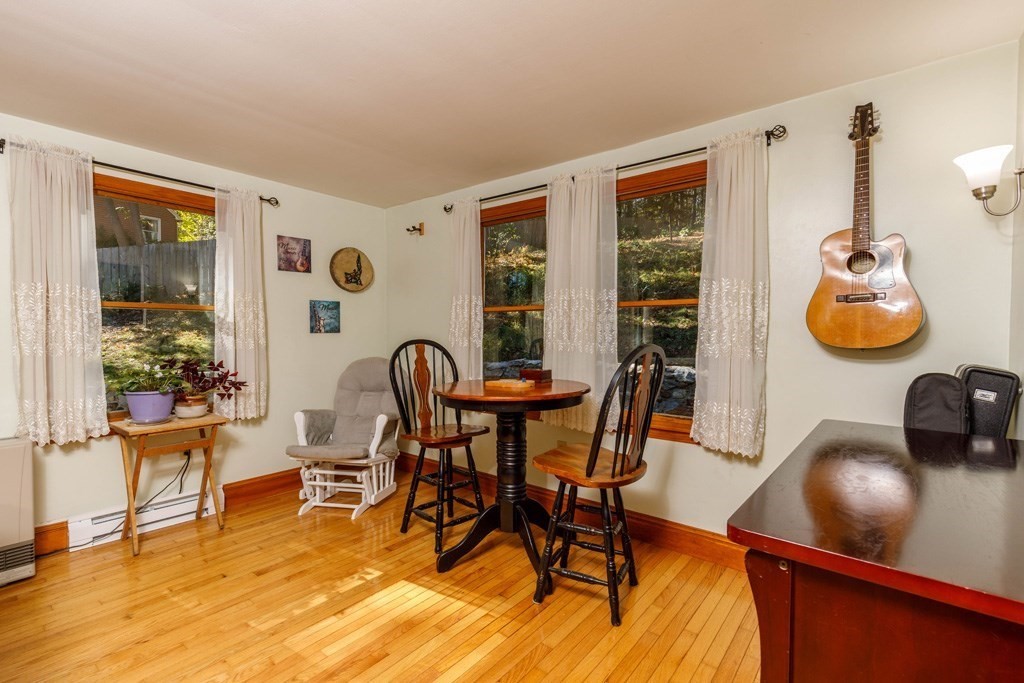 283 Mill Street Gardner, MA 01440 - Photo 9 of 30 a view of a dining room with furniture and chandelier