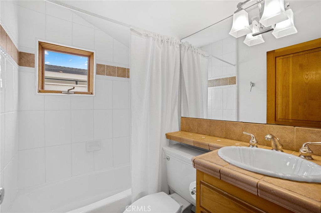 502 1/2 Goldenrod Avenue Corona del Mar, CA 92625 - Photo 12 of 15 a bathroom with a sink a toilet and shower