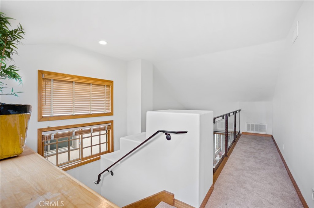 502 1/2 Goldenrod Avenue Corona del Mar, CA 92625 - Photo 13 of 15 a view of a hallway with windows