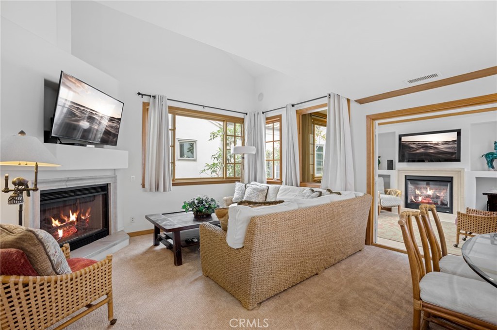 502 1/2 Goldenrod Avenue Corona del Mar, CA 92625 - Photo 4 of 15 a living room with furniture and a fireplace