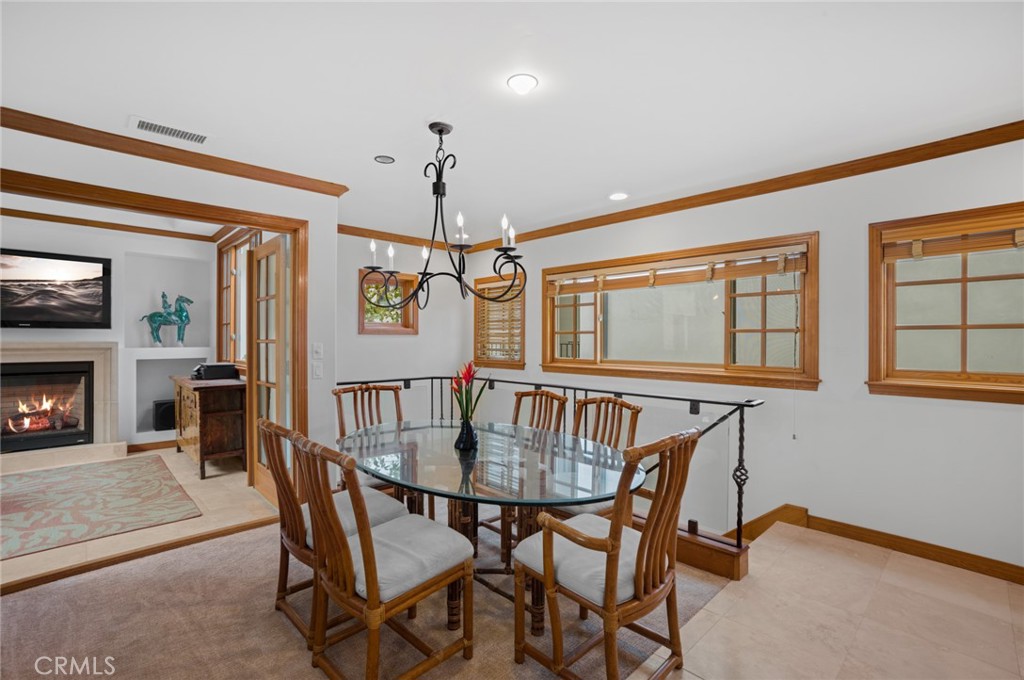 502 1/2 Goldenrod Avenue Corona del Mar, CA 92625 - Photo 5 of 15 a view of a dining room with furniture window and wooden floor
