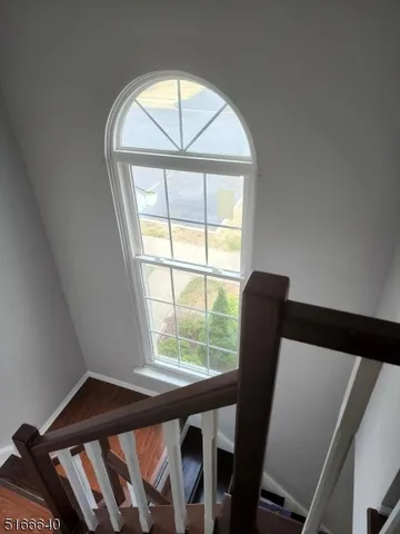 a view of a room with furniture and a window