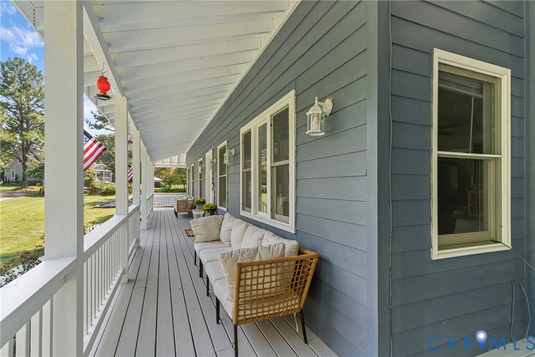 80 Mill Ridge Road Hartfield, VA 23071 - Photo 31 of 43 Expansive covered porch with white railing and cei