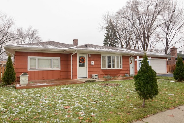 115 East Dennis Road Wheeling, IL 60090 - Photo 1 of 10 a front view of a house with garden