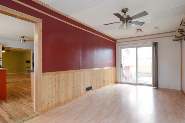 115 East Dennis Road Wheeling, IL 60090 - Photo 3 of 10 wooden floor in an empty room with a window