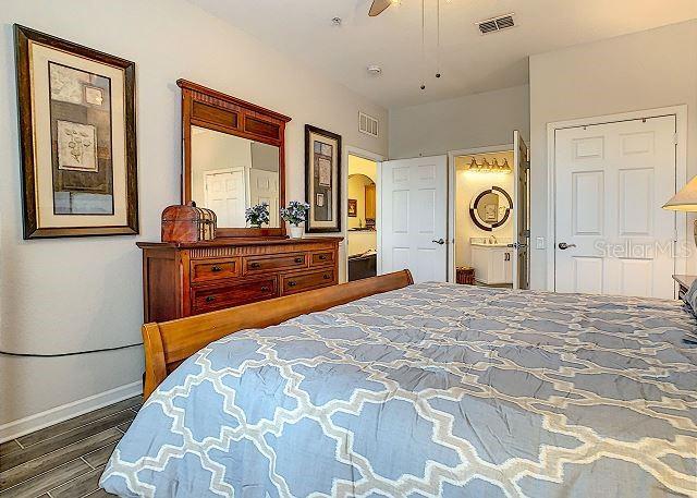 4862 Cayview Avenue, Unit 20909 Orlando, FL 32819 - Photo 14 of 38 a bedroom with a bed and a window