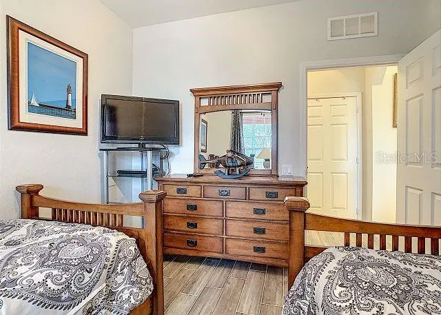 a bathroom with a sink mirror and toilet