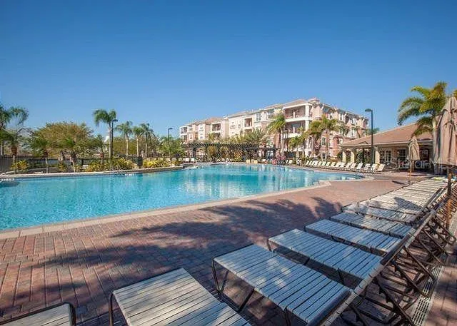 swimming pool view with a outdoor seating