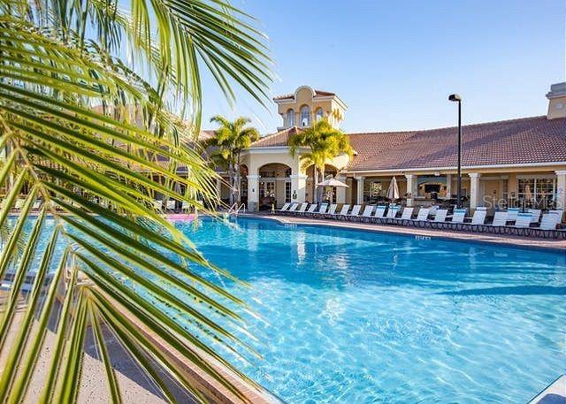 4862 Cayview Avenue, Unit 20909 Orlando, FL 32819 - Photo 33 of 38 swimming pool view with a outdoor seating