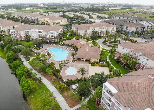 4862 Cayview Avenue, Unit 20909 Orlando, FL 32819 - Photo 4 of 38 an aerial view of a city with lots of residential buildings
