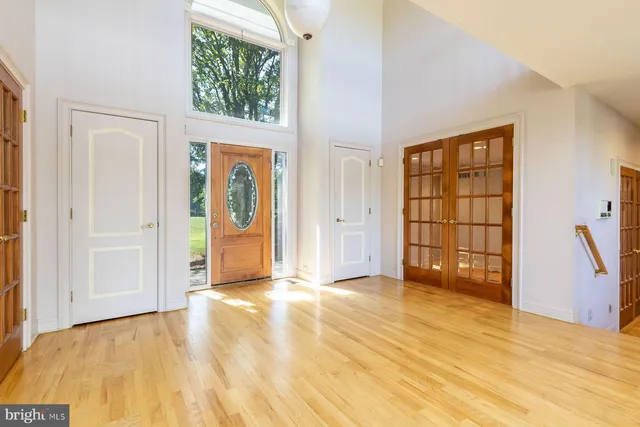 a view of an entryway with wooden floor