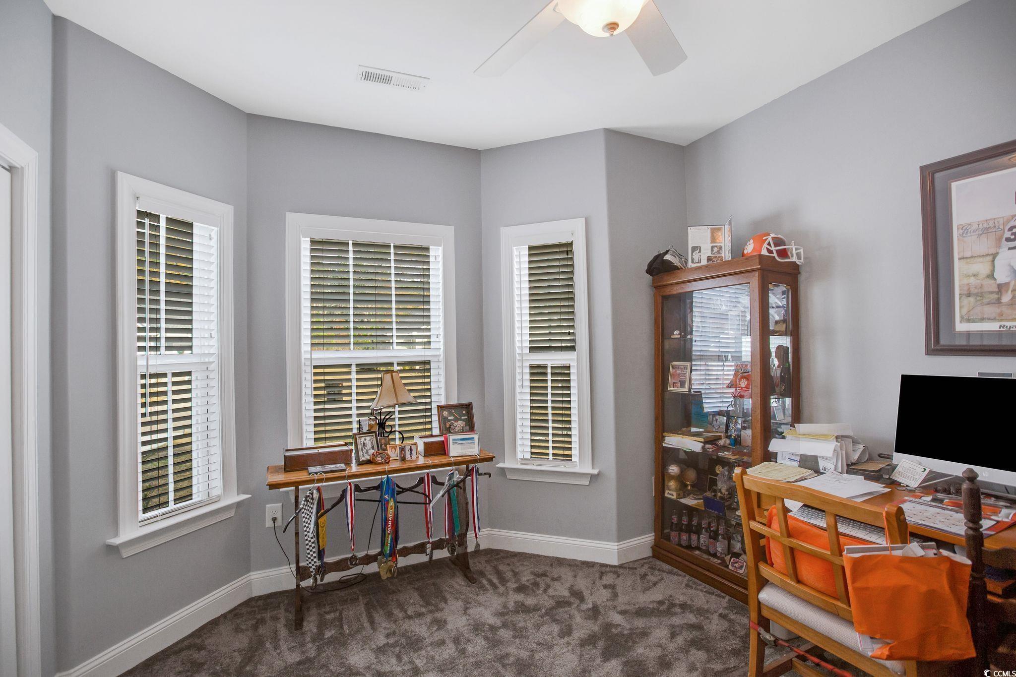 607 Garden Avenue Georgetown, SC 29440 - Photo 13 of 35 Carpeted office with ceiling fan