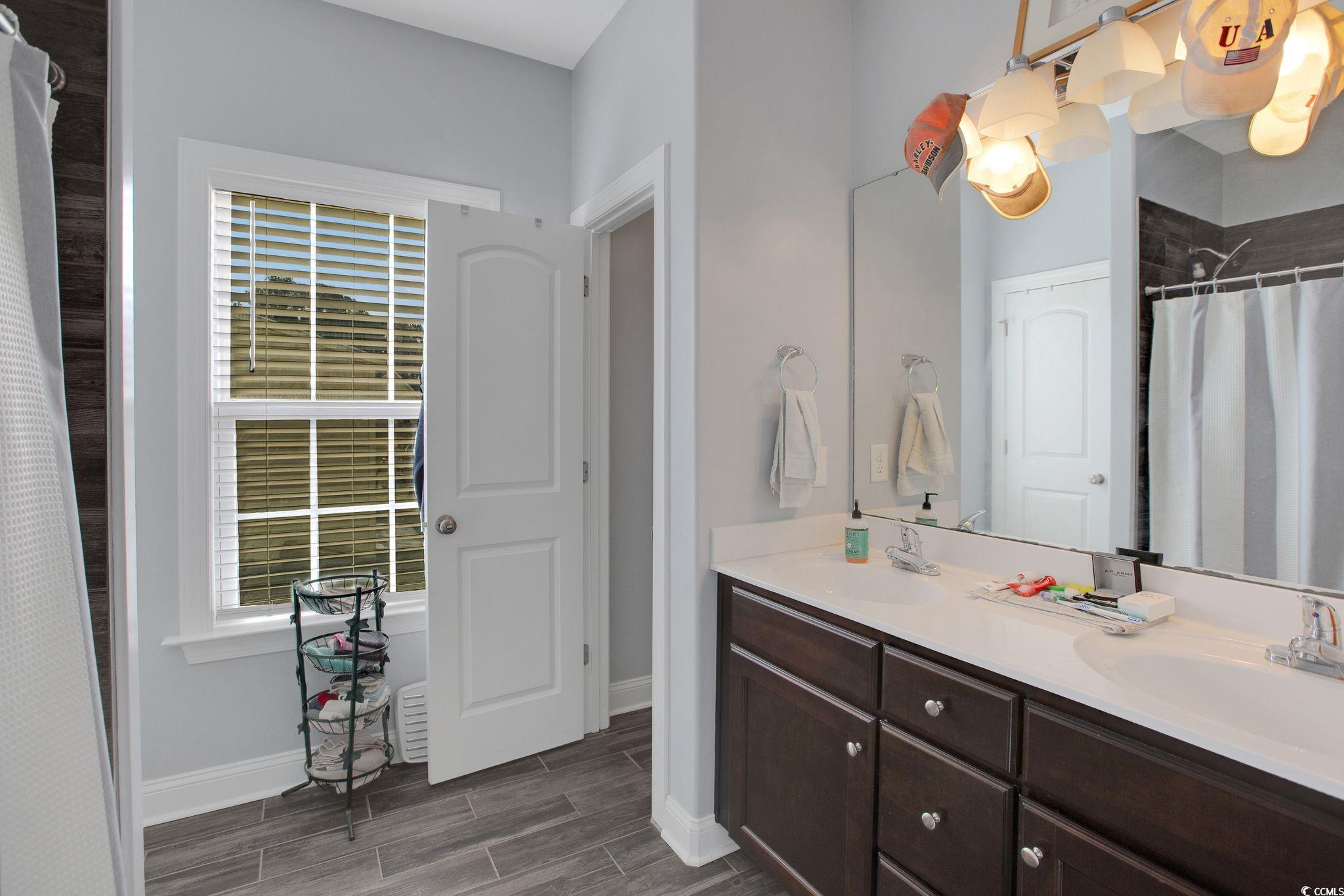 607 Garden Avenue Georgetown, SC 29440 - Photo 18 of 35 Bathroom with vanity and a shower with shower curtain
