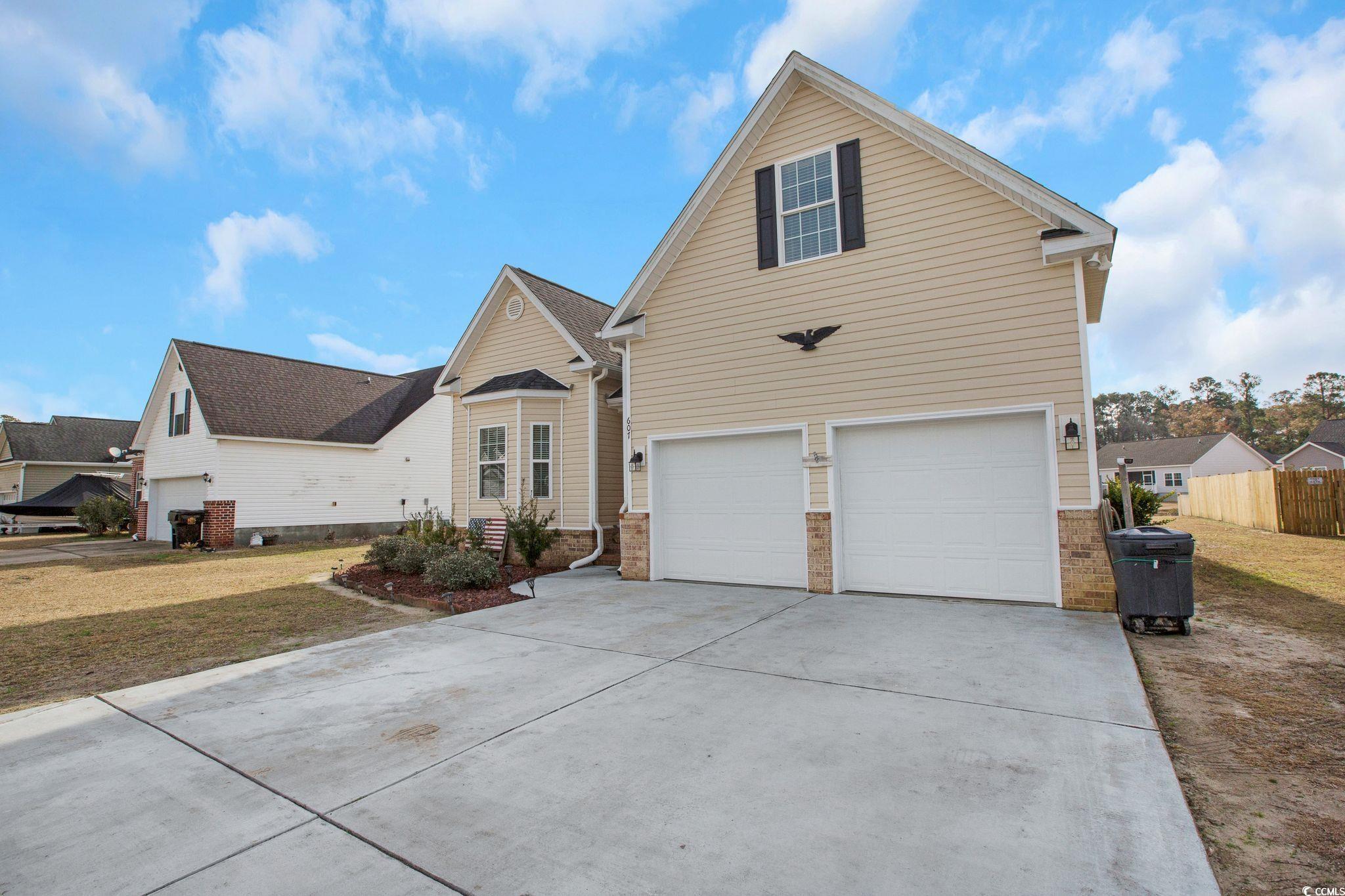 607 Garden Avenue Georgetown, SC 29440 - Photo 2 of 35 Front facade with a garage and a front lawn