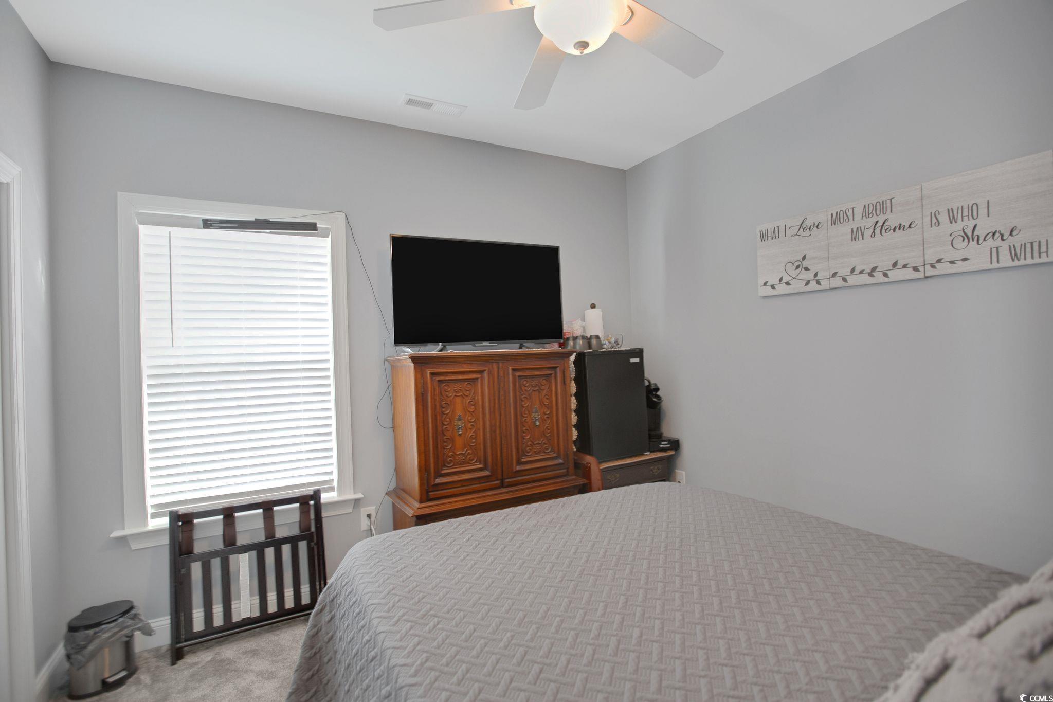 607 Garden Avenue Georgetown, SC 29440 - Photo 22 of 35 Bedroom with light carpet and ceiling fan
