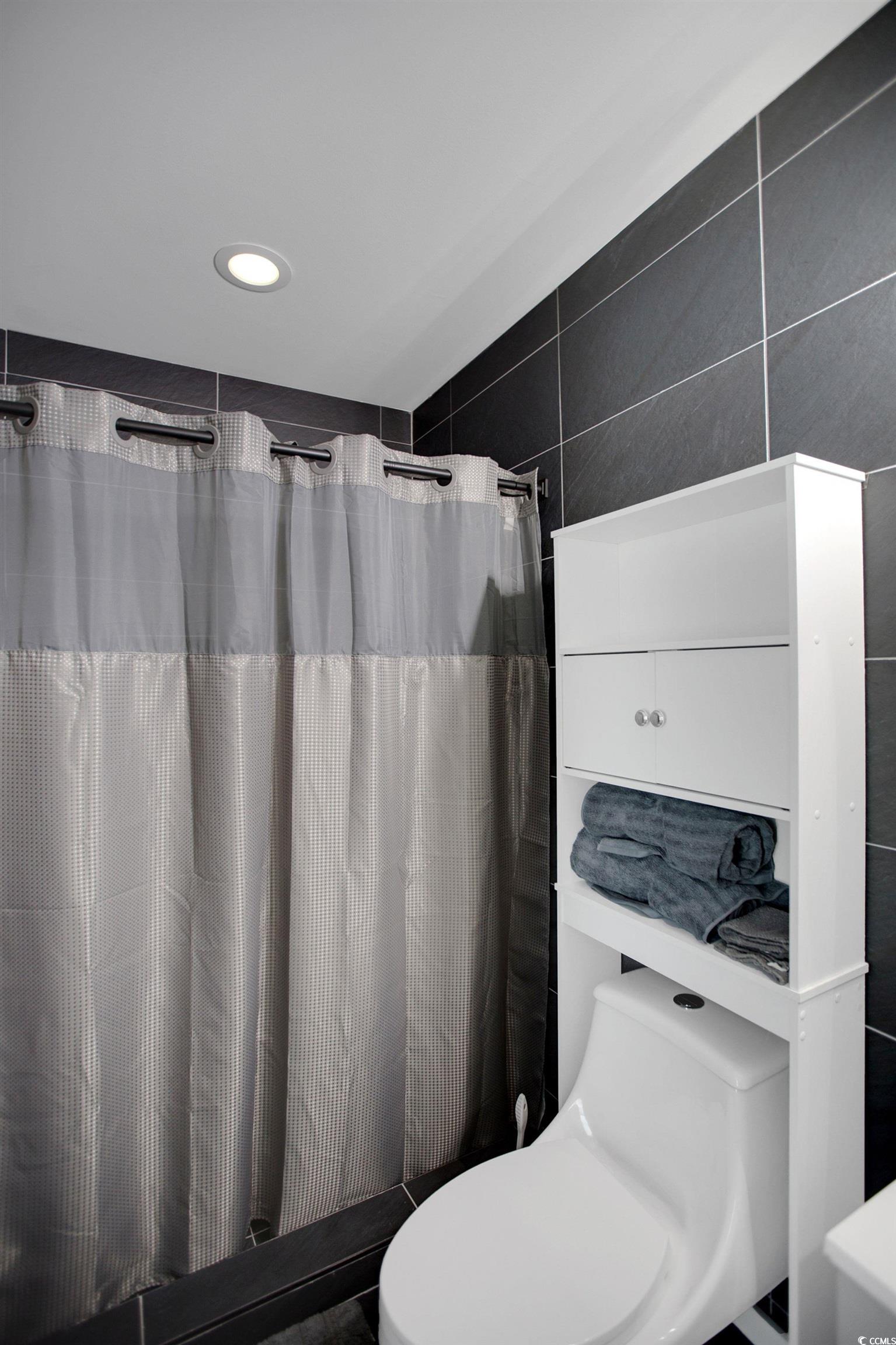 607 Garden Avenue Georgetown, SC 29440 - Photo 24 of 35 Bathroom featuring a shower with curtain and toilet