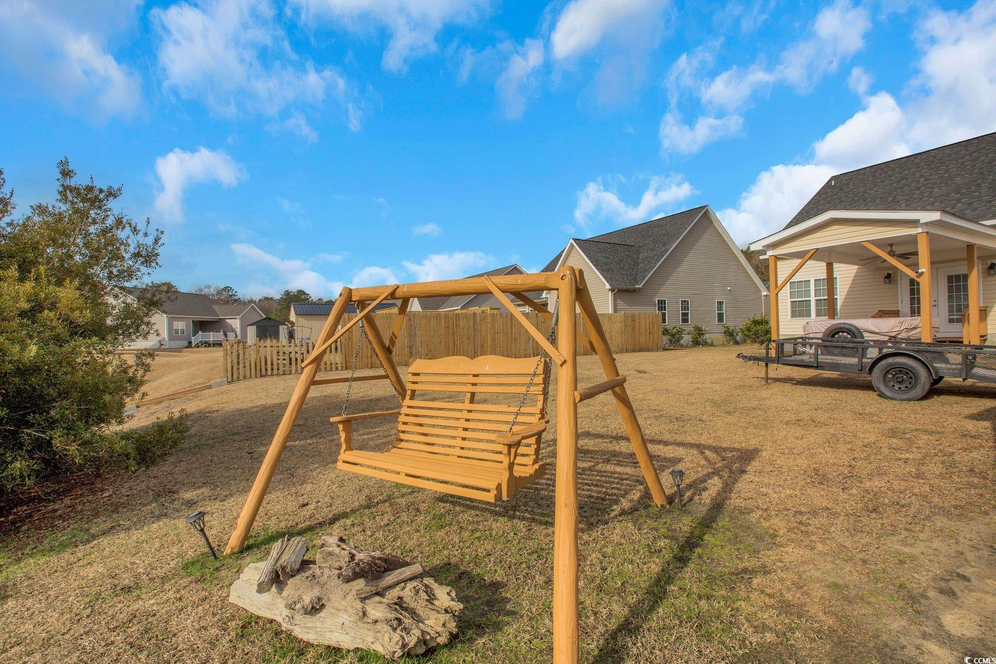 607 Garden Avenue Georgetown, SC 29440 - Photo 34 of 35 View of jungle gym featuring a yard and a fire pit