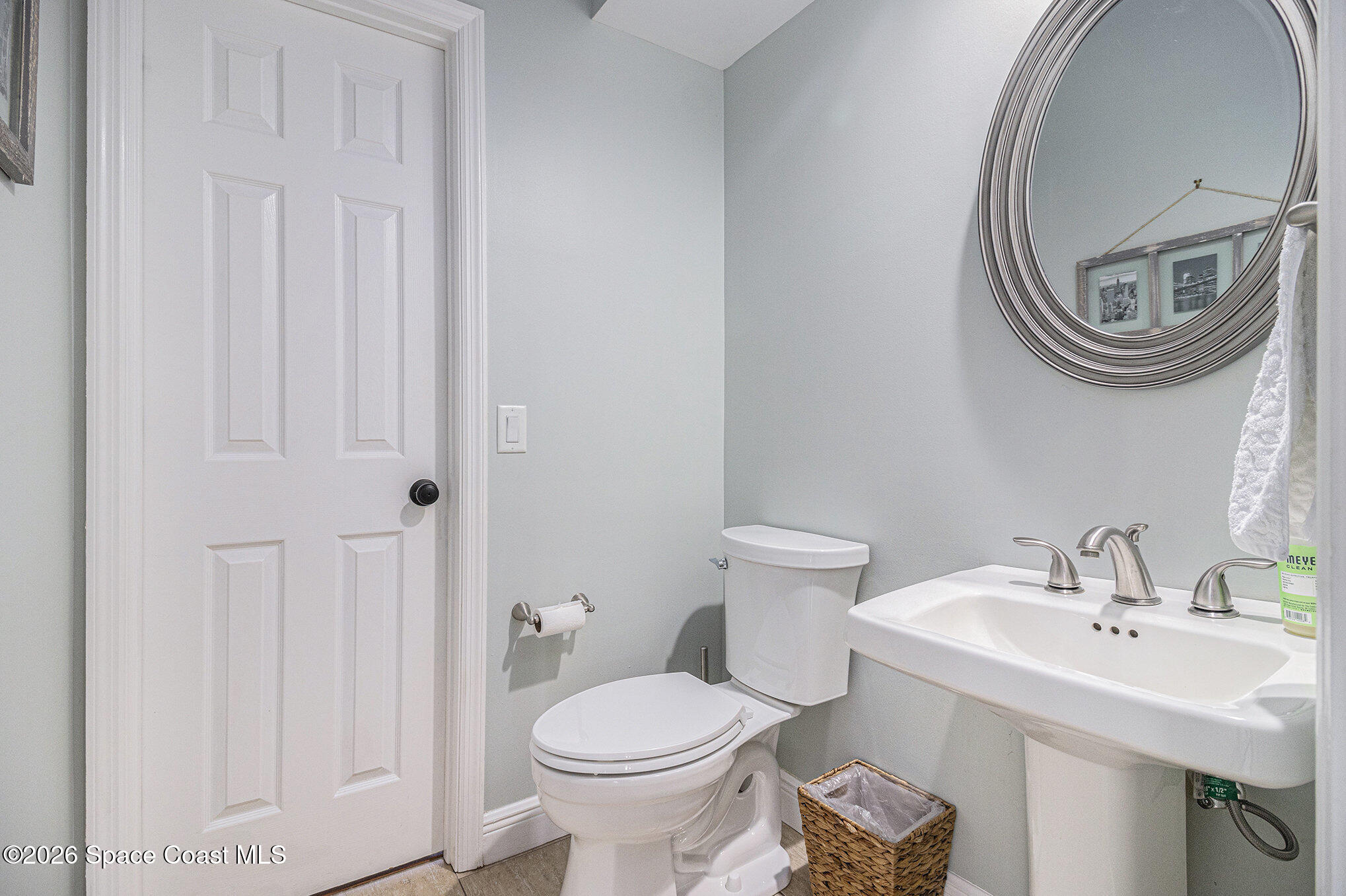 4115 Savannahs Trail Merritt Island, FL 32953 - Photo 14 of 42 a bathroom with a sink and a mirror
