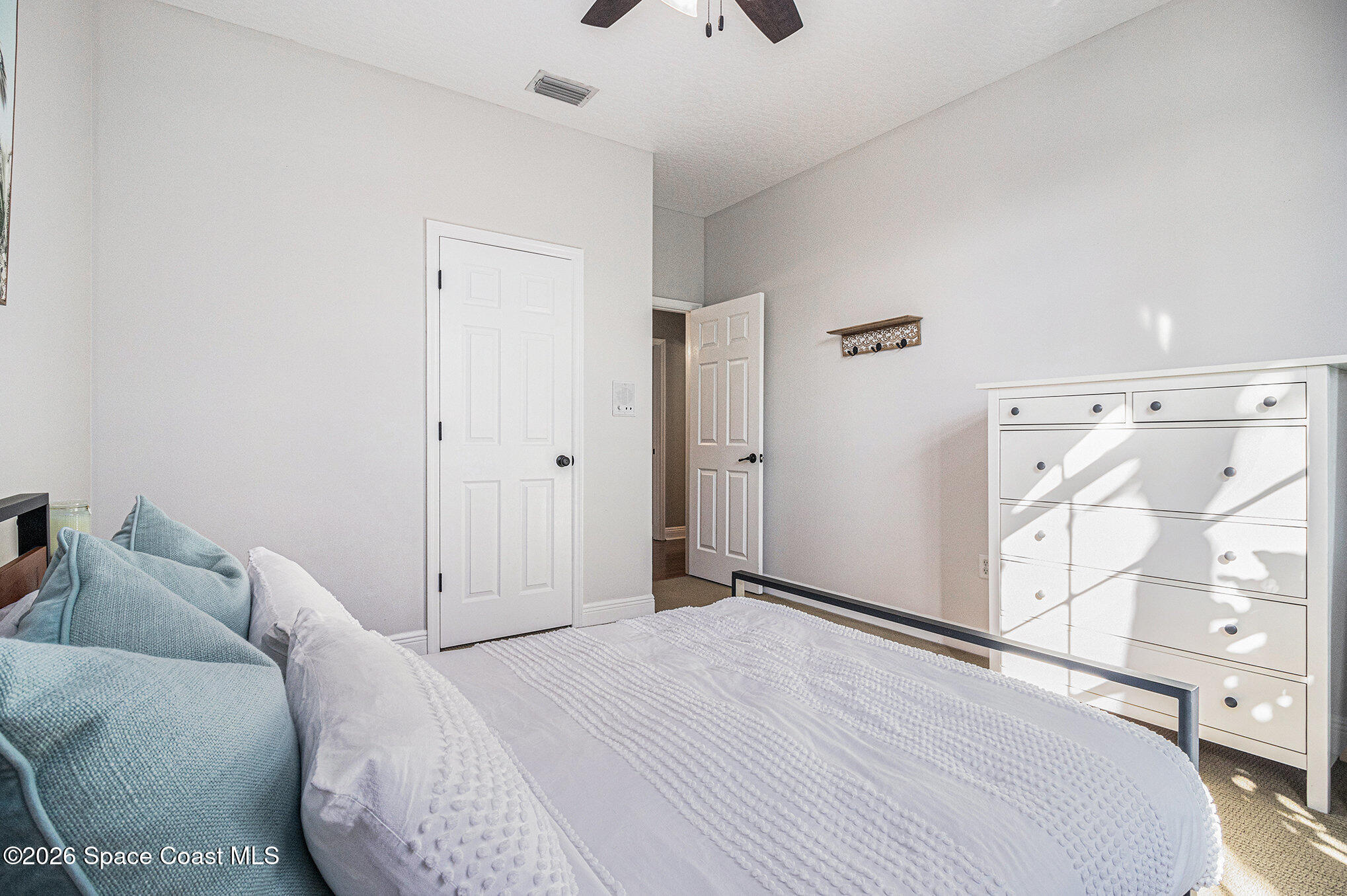 4115 Savannahs Trail Merritt Island, FL 32953 - Photo 17 of 42 a bedroom with a bed and a couch