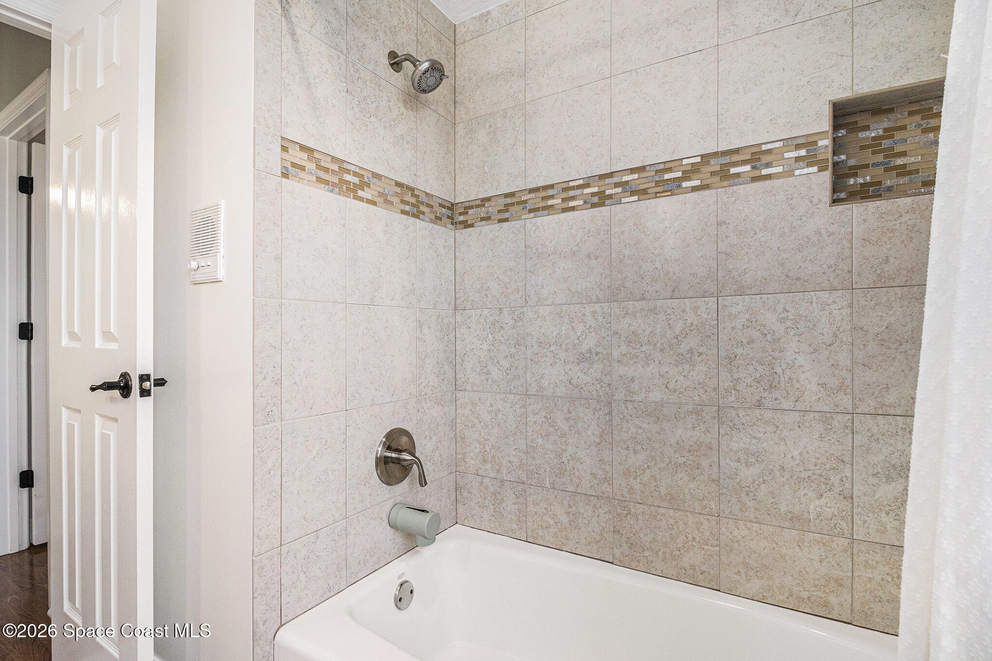 4115 Savannahs Trail Merritt Island, FL 32953 - Photo 22 of 42 a bathroom with a bathtub and a shower