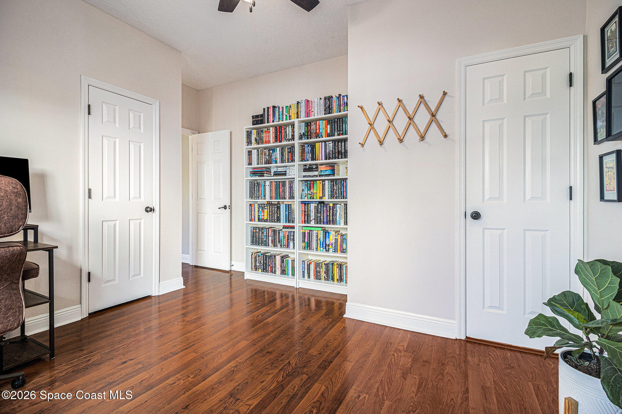 4115 Savannahs Trail Merritt Island, FL 32953 - Photo 24 of 42 wooden floor in an empty room with a window