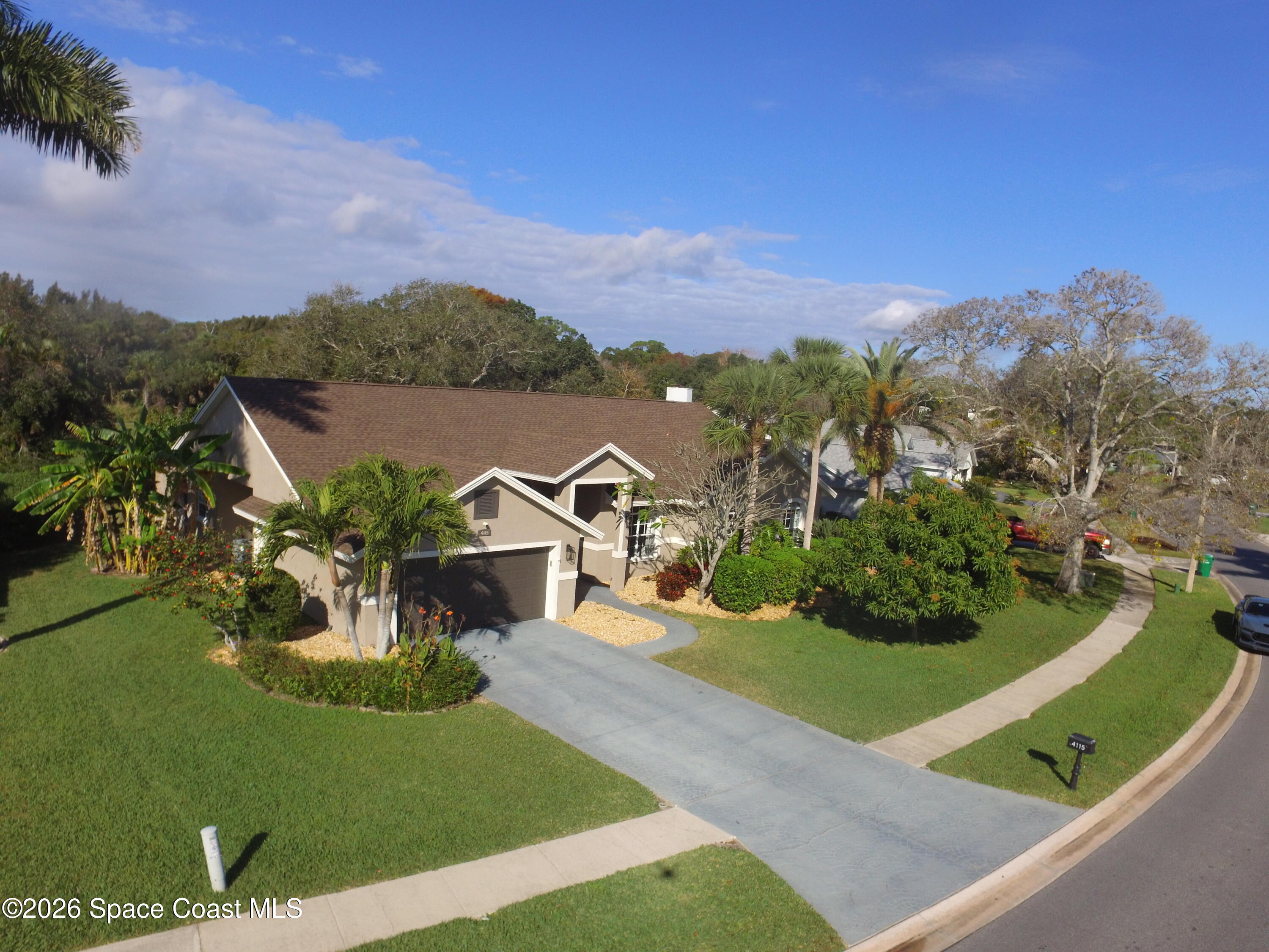 4115 Savannahs Trail Merritt Island, FL 32953 - Photo 37 of 42 an aerial view of a house with a garden
