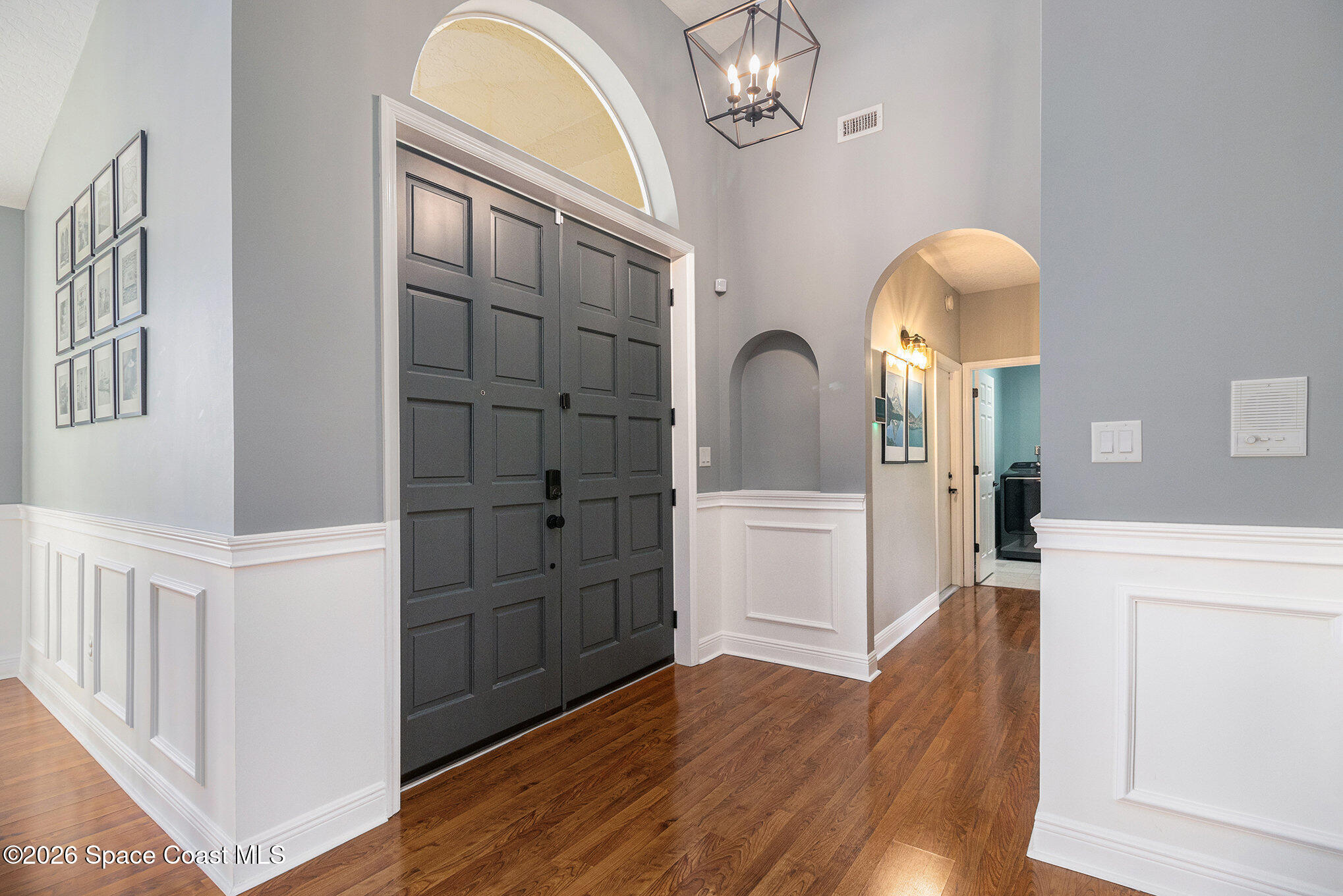 4115 Savannahs Trail Merritt Island, FL 32953 - Photo 4 of 42 wooden floor in an empty room with a window