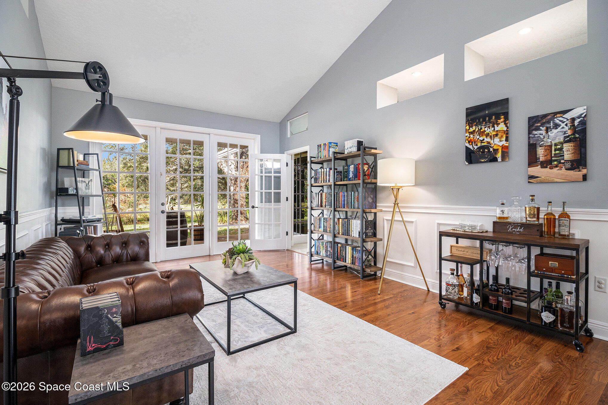 4115 Savannahs Trail Merritt Island, FL 32953 - Photo 6 of 42 a living room with furniture and a wooden floor
