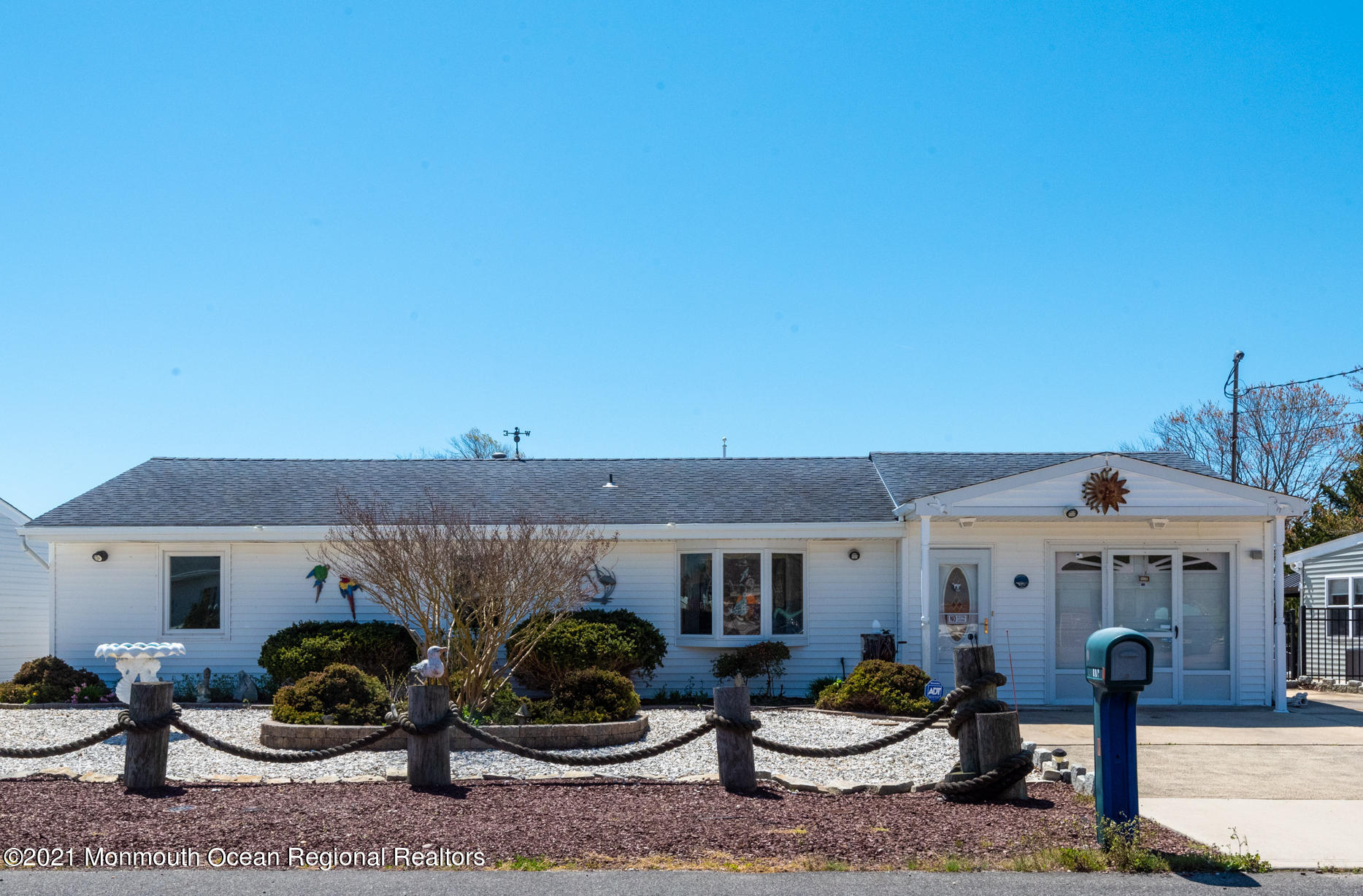 204 Maplewood Road Barnegat, NJ 08005 - Photo 2 of 26 a front view of a house with garden and plants