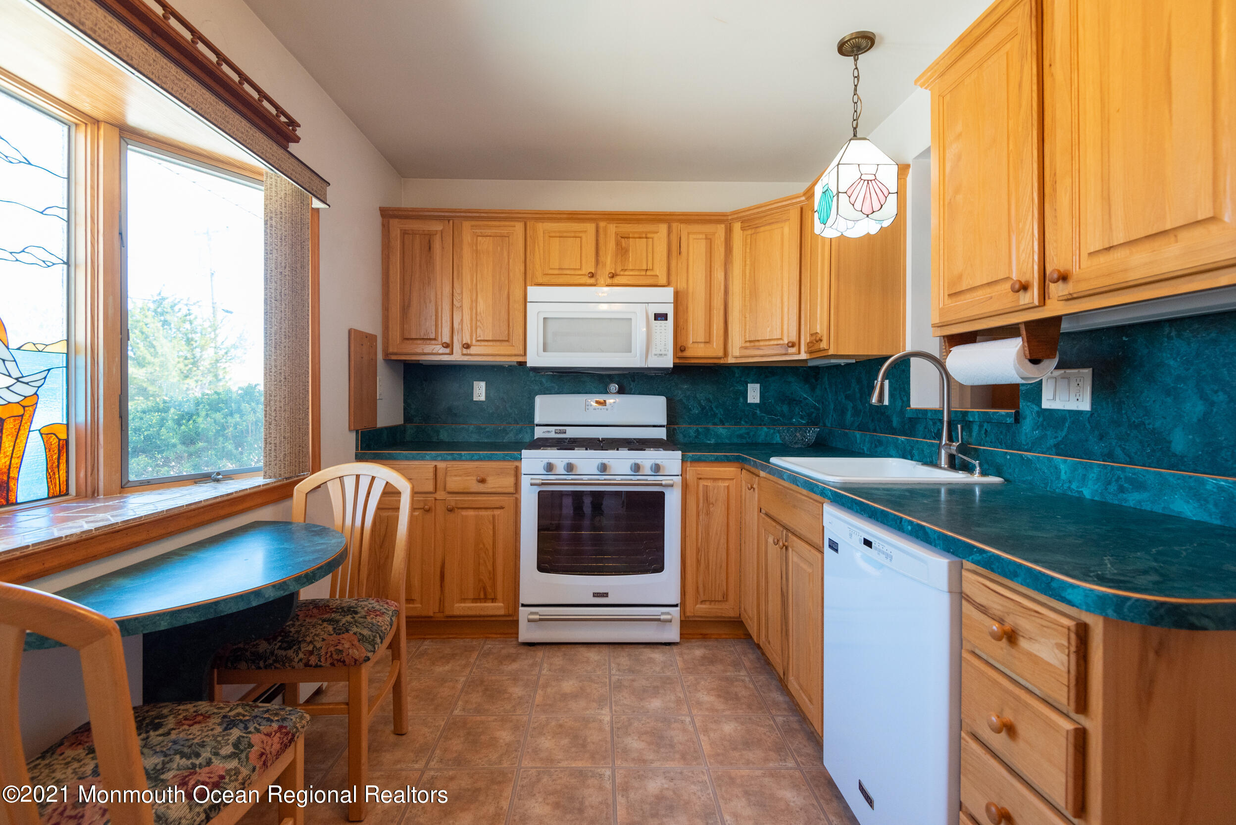 204 Maplewood Road Barnegat, NJ 08005 - Photo 16 of 26 a kitchen with stainless steel appliances granite countertop a stove a sink and a microwave