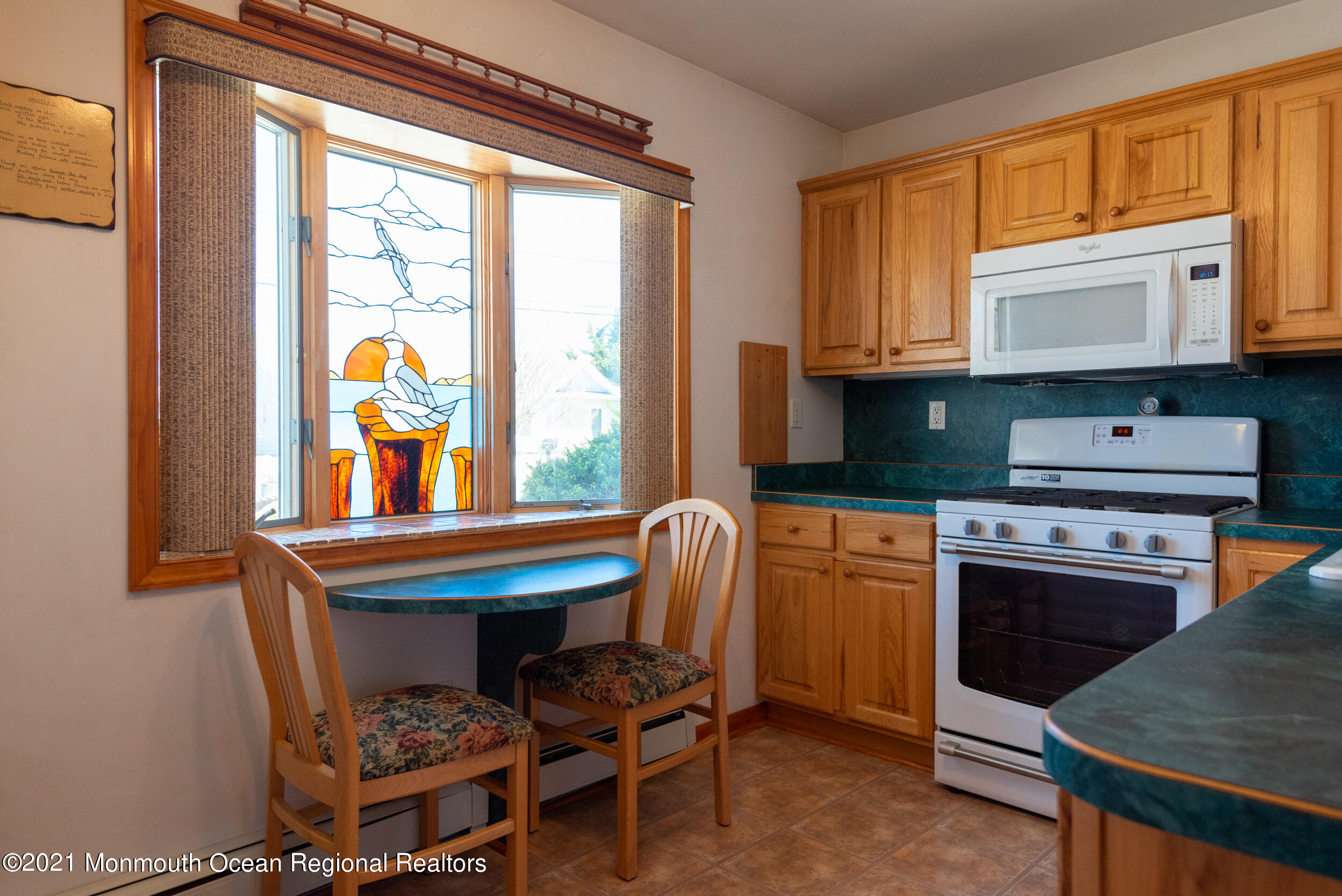 204 Maplewood Road Barnegat, NJ 08005 - Photo 17 of 26 a kitchen with stainless steel appliances granite countertop a stove a sink and a refrigerator