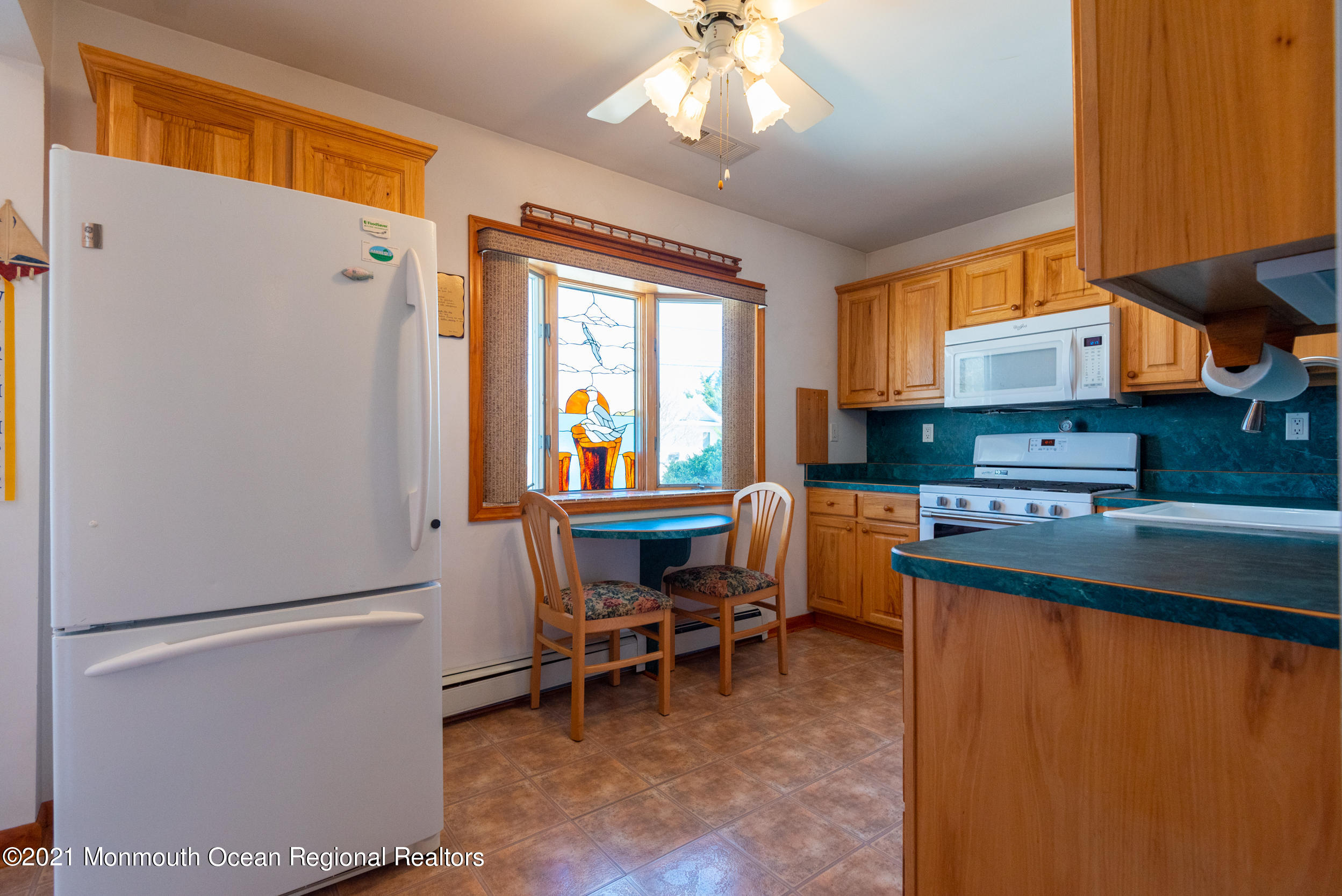 204 Maplewood Road Barnegat, NJ 08005 - Photo 18 of 26 a kitchen with stainless steel appliances granite countertop a refrigerator and a stove