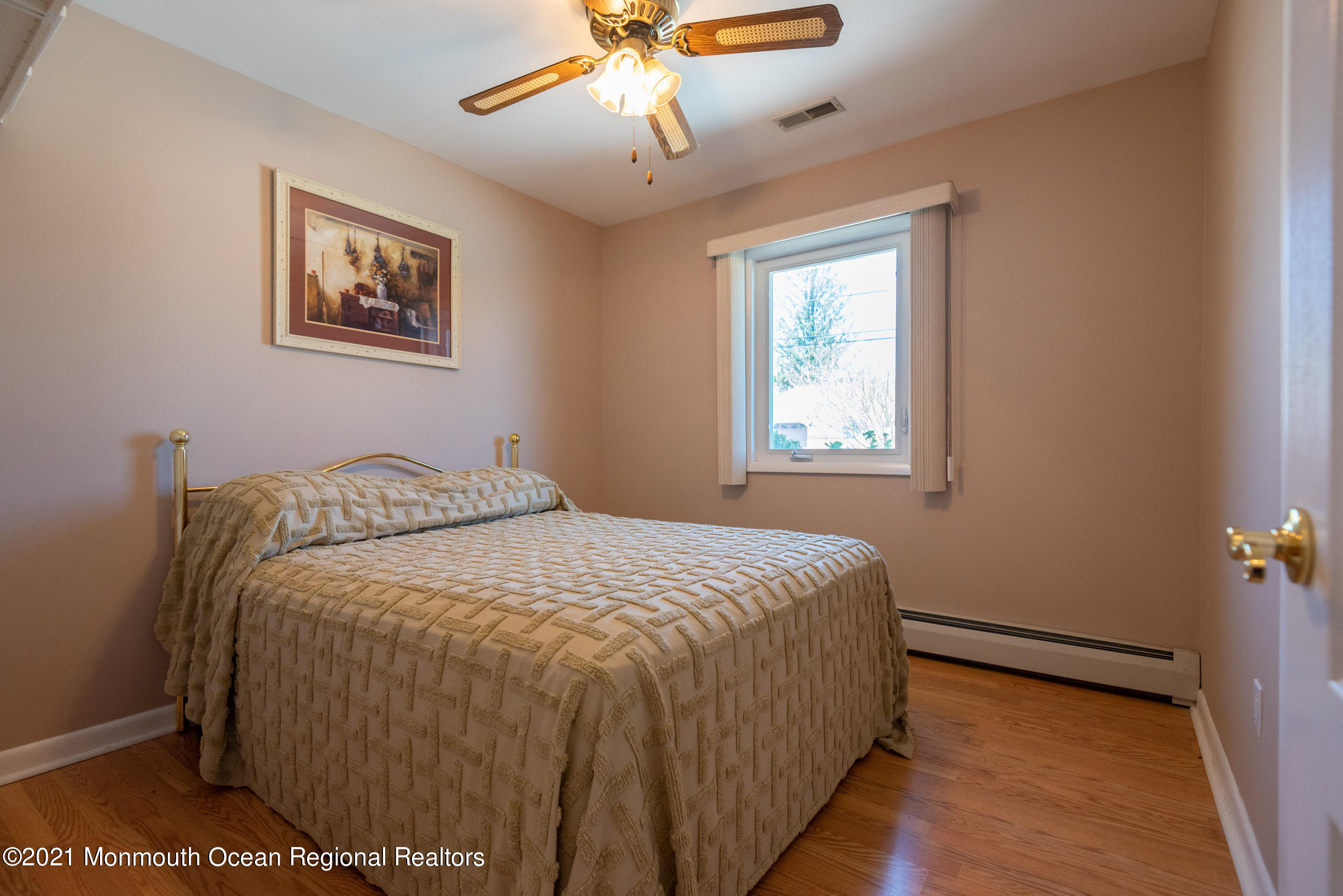 204 Maplewood Road Barnegat, NJ 08005 - Photo 20 of 26 a bedroom with a bed and a window