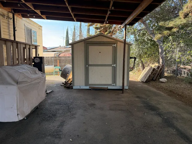 an aerial view of a house with a swimming pool yard and outdoor seating