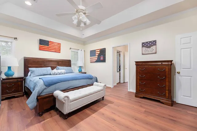 a bathroom with a tub shower and toilet