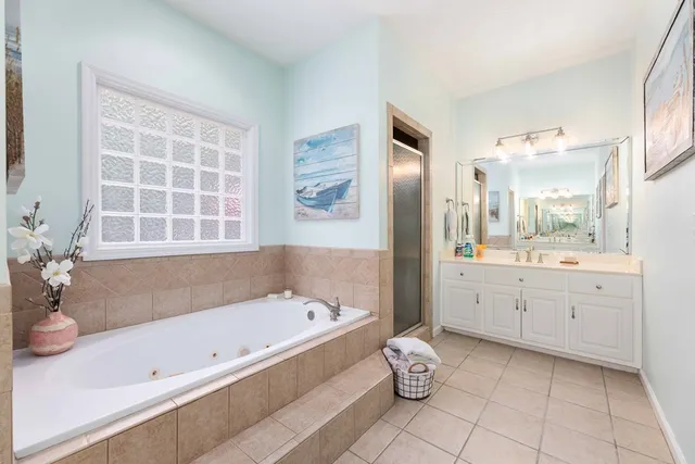 a bed room with a bed and a chair