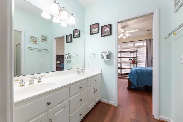 a view of a room with wooden floor and windows