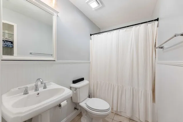 a kitchen with a refrigerator and sink