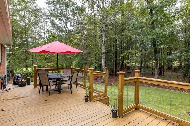 a view of a house with backyard porch and sitting area