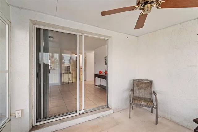 a bathroom with a glass shower door and mirror