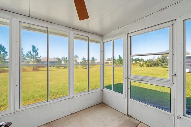 a view of an empty room with a large window