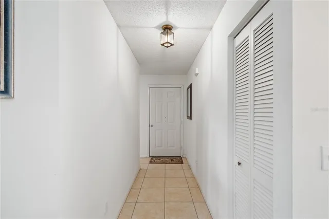a view of a hallway with a door