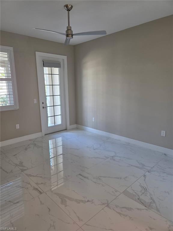 16370 Viansa Way, Unit 6 Naples, FL 34110 - Photo 12 of 27 Spare room featuring baseboards and a ceiling fan