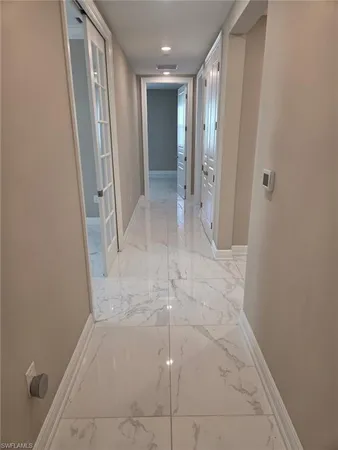 a kitchen with a sink appliances and cabinets