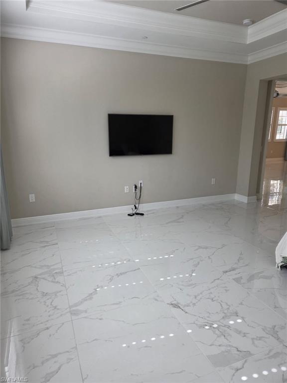 16370 Viansa Way, Unit 6 Naples, FL 34110 - Photo 25 of 27 Spare room featuring ornamental molding and baseboards