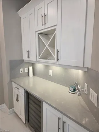 a kitchen with stainless steel appliances granite countertop a sink a stove and cabinets