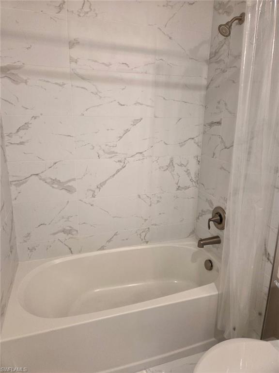 16370 Viansa Way, Unit 6 Naples, FL 34110 - Photo 10 of 27 Bathroom featuring shower / bath combo and toilet